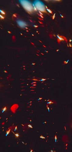 blurry image of red and blue lights in the dark night sky with no flash