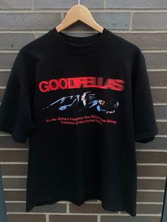 "Vintage 1990 Goodfellas Movie Promo Vintage Shirt  - Missing Tag - Fits like Large (Length 27\", Chest 22\") - Overall great vintage condition (no holes/ no stains) - Message for more information Please take note of the measurements listed as these are vintage clothes and may fit different than the tag size. Follow our page for more vintage clothing drops!" Famous T Shirt Design, Movie Graphic Tees, Movie Tshirt Designs, Mens Vintage Tees, Graphic Vintage Tees, Graphic Tshirt Design Prints Vintage, Vintage Shirt Designs Graphic Tees, Vintage Tshirt Design Graphics, Vintage T-shirt