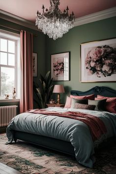 a bedroom with green walls, pink curtains and a chandelier hanging from the ceiling