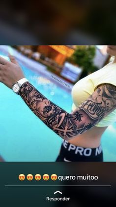 a woman with tattoos on her arm next to a swimming pool