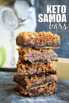 three chocolate and coconut bars stacked on top of each other with the words keto samoa bars above them