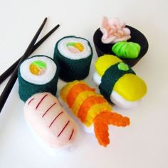 sushi and chopsticks on a white table