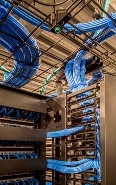 the inside of a server with many blue wires