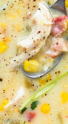 a spoon full of soup with corn and meat