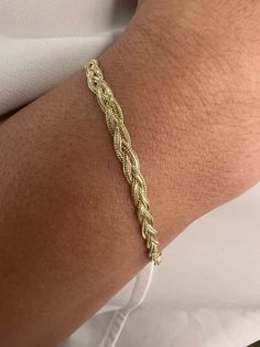 Enjoy the beautiful workmanship of our 14K Solid Foxtail Chain Yellow Gold Braided Bracelet a 7.00" Inch woven beauty with a delicate 3.5mm width, blending delicacy and sophistication. Made from real 14K yellow gold, the foxtail chain design, known for its intricate pattern and strength, features a braided design for added charm. Products Specification: -------------------------------- * Materials: 14K Gold * Stamped 14K Gold ((Stamped 14K for Authenticity) * Finish: Polished * Closure: Lobster claw * Chain style: Braided Weaved Bracelet * Bracelet Width: 3.5mm * Bracelet Length: 7.00" Inch * Condition: Brand New Processing Time: ------------------------ Our standard turnaround time is approximately 2 - 4 business days, subject to change during peak seasons. For the most up-to-date process Chain Braid, Woven Bracelet, Great Gifts For Women, Braided Bracelet, Chain Design, Woven Bracelets, Yellow Gold Chain, Elegant Accessories, Braided Bracelets