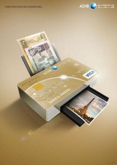 a gold credit card with an image of the eiffel tower on it is shown