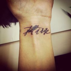 a small wrist tattoo with the words, not life on it