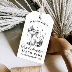 a gift tag with the name hannah's bachelor beach club on it