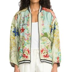 65% Cupra/35% Rayon Reversible Zipper Measurements For Size Medium: Length- 24 1/4", Bust- 25" Care Instructions: Dry Clean Only With Two Ways To Wear, Our Reversible Mizumi Bomber Pairs Stylish Form With Bohemian Ease. This Trendy Jacket Features Lush Botanical Prints, Sporty Accents, And A Laid-Back Form. Whether You’re Looking To Dress It Up Or Down, You Can Effortlessly Style This Jacket With Light-Washed Denim Or Leggings And Flats For A Chic Boho Look. Green Silk Outerwear For Spring, Casual Silk Outerwear For Work, Fall Silk Outerwear With Floral Print, Silk Long Sleeve Summer Outerwear, Casual Long Sleeve Silk Outerwear, Trendy Jackets, Military Style Jackets, Boho Look, Johnny Was