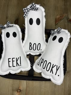 three white pillows with black polka dots and the words boo spooky on them