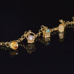 Etruscan Italian Fratelli Chini / Ponzzali 18k Solid Gold Gemstones Charm Bracelet. This Bracelet Already Has Five Magnificent Multi-Color Gemstone Studded Charms. There Is Plenty Of Space To Add More Charms If Desired. This Bracelet Has A Stunning Smooth / High Shine Rolo Links Chain Design. Extremely Durable Solid Gold Bracelet. This Bracelet Closes With A Lobster Clasp, So Its Very Secure And Safe To Wear. The Five Charms Are Meticulously Made With Attention To Fine Details Throughout. The Charms Feature Multiple Gemstones, Textures, Beaded, Twisted Wire And Engraving Work In Solid 18k Yellow Gold. The Charms And The Bracelet Have A Slight Patina. This Patina Looks Amazing, Since It High Italian Charm Bracelets, Gold-tone Charms Gold Plated Bracelet, Adjustable Gold-tone Charm Bracelet, Gold Italian Charm Bracelet, Elegant 14k Gold-tone Charm Bracelet, Gold-tone Metal Charm Bracelet With Vintage Charm, Pearl Charm Bracelet, Solid Gold Bracelet, Gemstone Studs