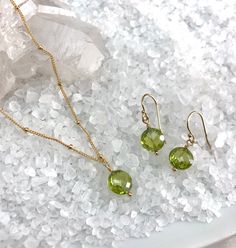 Beautiful August Birthday Gift idea! Peridot Earrings for those August Babies! Checker-board faceted Peridot earrings, in a simple design that show off the beautiful faceting. Hand wrapped to ear wires with gold-filled components. Length 15/16" from top of the ear wire, 8mm Peridot gemstone. Silicon ear backs included. All jewelry comes packaged in gift box with pink organza ribbon. Care instructions also included. Peridot Bracelet, August Birthday, Peridot Pendant, Peridot Earrings, Peridot Necklace, August Birthstone, Organza Ribbon, Peridot Gemstone, August Birth Stone