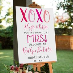 a sign that says xoxo hugs and kisses for the soon to be mrs welcome to kathy's bridal shower