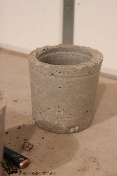 a cement cup sitting on top of a table