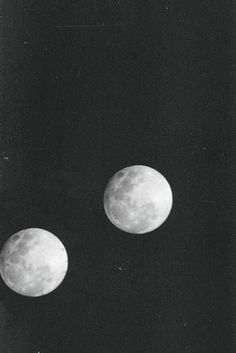 three phases of the moon are shown in this black and white photo, with only one half visible