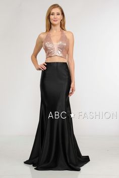 Sparkle and shine in this two-piece gown with sequined crop top by Poly USA 8294. Gorgeous two-piece dress with sequins halter V-neck crop top secured by a sheer illusion panel, mermaid silhouette span satin black skirt, and a back zipper closure. Affordably priced under $170, this dress is perfect for any formal event and will keep you on budget! Designer: Poly USA Style Number: 8294 Material: Sequins, Span Satin, 100% Polyester Details: Bra Cup, Fully Lined Fit: The model is 5'9" Colors: Rose Fitted Two-piece Dress For Prom Season, Fitted Two-piece Dress For Prom, Fitted Two-piece Evening Dress For Prom, Fitted Sequin Skirt For Prom, Fitted Two-piece Dress For Prom Evening, Fitted Two-piece Dress For Evening Prom, Fitted Skirt For Prom And Party Season, Satin Black Skirt, Matric Ball Dresses