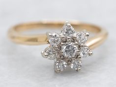 an image of a ring with diamonds on the top and bottom part, in yellow gold or white gold