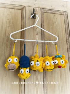 three crocheted stuffed animals hanging from a hook