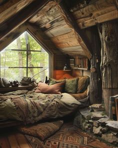 an attic bedroom with wooden walls and flooring is decorated in rustic style, while the bed has pillows on it