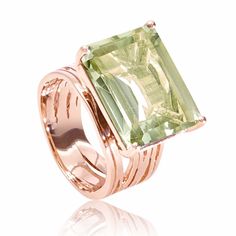 Make a statement with this elegant cocktail ring!The handmade ring has a striking and contemporary design with a distinctive 18ct Rose Gold Vermeil setting.This unique piece features a large baguette cut Green Amethyst semi-precious gemstone in a raise prong setting. The linear setting and geometric cut are contrasted by several organic, interwoven gold bands. The inspiration for this design comes from architectural forms and fluid shapes found in nature.This original designer piece has been han Rose Gold Cocktail, Gray Gemstones, Green Amethyst Ring, Gold Cocktail Ring, Gold Cocktail, Pink Ring, Rose Gold Jewelry, Green Amethyst, Rose Gold Earrings