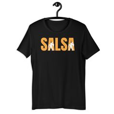 Description: Show off your love for salsa with our Salsa T-Shirt, designed for passionate dancers and salsa enthusiasts. Whether you're hitting the dance floor or staying active at the gym, this versatile tee is perfect for every salsa lover who wants to combine style with comfort. For Sizing Please Ignore The US Letter Words.  Features: Design: A chic and dynamic design that celebrates the energy and rhythm of salsa dancing, making it a standout piece for any dancer. Material: Made from 100% hi Fitted Crew Neck T-shirt For Dance, Fitted T-shirt For Summer Dance, Salsa Dancer, Dance Instructor, Staying Active, Gym Shirt, Salsa Dancing, Dance Practice, Dynamic Design