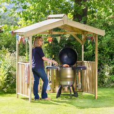 a woman grilling on an outdoor bbq