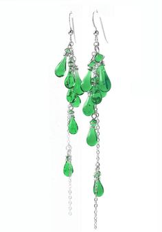 These waterfall earrings of dangling silver and clustered glass teardrops will take you anywhere you want to go! Enchanting glass droplets cluster near the top, trailing down to a dangling tail of glistening silver.Are you looking to put the finishing touch on a special outfit for a momentous day? Whether it’s a formal night out with your special guy or your daughter’s wedding, in these waterfall earrings you’ll know you look superb. Earring length: 4.4" (11cm) Eco-friendly jewelry, made from su Silver Drop Chandelier Earrings, Silver Teardrop Cluster Earrings For Party, Teardrop Dangling Charms Jewelry For Party, Party Sterling Silver Drop Chandelier Earrings, Sterling Silver Party Chandelier Drop Earrings, Sterling Silver Long Drop Teardrop Earrings For Party, Silver Teardrop Crystal Earrings With Dangling Beads, Teardrop Dangling Charms Earrings For Party, Long Drop Chandelier Earrings With Dangling Beads