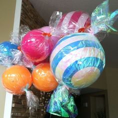 balloons are wrapped in plastic bags and tied to the ceiling