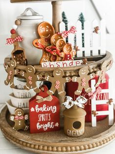 a tray with ginger cookies on it and other items in front of the cake stand