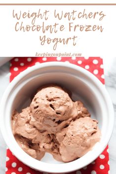 a bowl filled with chocolate ice cream on top of a red and white table cloth