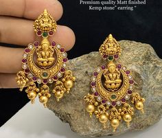 ## Embrace Lakshmi's Grace with These Exquisite Kundan Earrings ✨ **Awaken your inner goddess** with these stunning Lakshmi earrings, handcrafted from real kundan and plated in gleaming rhodium gold. **Embrace the beauty of tradition * **Genuine Kundan stones** for timeless elegance and a touch of royalty. * **Rhodium gold plating** adds a luxurious shine that resists tarnish. * **Handcrafted by skilled artisans** for a unique and meaningful piece. * **Perfect for both women and girls** to celeb Lakshmi Earrings, Laxmi Devi Earrings Gold, Lakshmi Devi Earrings Gold, Lakshmi Earrings Gold, Gold Earrings Models, Indian Jewelry Earrings, Indian Jewelry Sets, Kundan Earrings, Gold Jewelry Simple