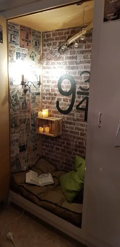 a room that has a brick wall with the number 39 written on it and a lit candle