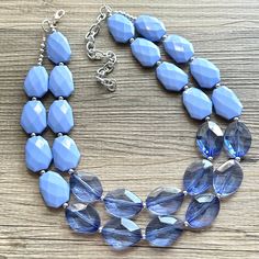 💞LAST ONE & ready to ship💞  Such a fun piece! Add a subtle touch of color to your ensemble. 16 inches with a 4 inch extender chain. Hate to wait? Me too! I ship 6 days a week!   Thank you for browsing my store! Check out my other items: PolkaDotDrawer.Etsy.com Blue Bib Necklace With Large Beads, Blue Double Strand Necklaces For Party, Blue Adjustable Bib Necklace With Round Beads, Adjustable Blue Bib Necklace With Round Beads, Blue Double Strand Necklace For Party, Blue Double Strand Faceted Bead Jewelry, Blue Faceted Beads Double Strand Jewelry, Blue Costume Jewelry Beaded Necklace With Faceted Beads, Blue Double Strand Beaded Necklace For Gift