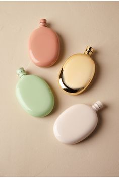 three different types of perfume bottles on a table