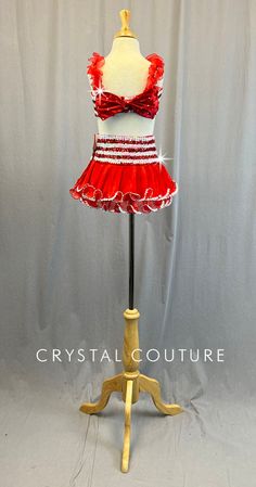 Red and White striped top is fully sequined with Red ruffle straps and large Red bow in back. Skirt is a two layer Red ribbed chiffon with ruffled edges. Waistband is Red and White striped sequins. *Accessories Include: Red and White Bow Hair Clip with Peppermint Candy. ****Costume is a YM photographed on YM/YL mannequin measuring: Bust 27"; Waist 24"; Hips 27"; Girth 47"**** Two Piece Top And Skirt, Candy Costume, Baggy Clothing, Back Skirt, Bow Hair Clip, Costumes For Sale, Peppermint Candy, Top And Skirt, White Bow