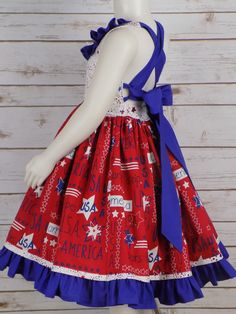 "USA America Stars & Stripes fabric Girls Halter Style Dress is perfect for all your 4th of July events. How Cute is this Style dress with a Lined bodice and Neck ruffle. Long Straps Cross in the Back and Tie into a Big Bow. Full Twirl Skirt with Star Border and Blue Ruffle Grow with Me style so it can be worn from Memorial Day to Labor Day Sizes available for Babies, Toddlers, Little Girls up to Teens Size 14 Handmade Made in the USA by me! -------------------------------------------------- Patriotic Blue Cotton Dress, Blue Patriotic Cotton Dress, Blue Cotton Patriotic Dress, Red Patriotic Dress For 4th Of July, Patriotic Red Dresses For 4th Of July, Fitted Sleeveless Dress For 4th Of July, Patriotic Sleeveless Red Dress, Girls Western Dresses, 4th Of July Events