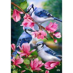 three blue birds perched on top of pink flowers