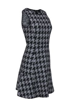 You'll be a hottie in houndstooth in this dress from Theory! Featuring a houndstooth print throughout, this adorable fit and flare dress is perfect for adding some style to your work wardrobe. Pair with black heels and a cozy cardigan for a chic office look. Size 6 80% Cotton, 10% Polyamide, 7% Viscose, 3% Elastane Concealed back zipper Unlined Fit and flare silhouette Round neckline Sleeveless Houndstooth print Bust 34” Waist 28” Shoulder to hem 38" Fitted Sleeveless Houndstooth Mini Dress, Fitted Sleeveless Mini Dress With Houndstooth Pattern, Chic Sleeveless Mini Dress With Houndstooth Pattern, Casual Sleeveless Houndstooth Mini Dress, Fitted Houndstooth Mini Dress For Winter, Sleeveless Houndstooth Dress For Spring, Chic Sleeveless Houndstooth Dress, French Girl Chic, Black Houndstooth