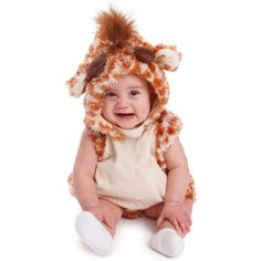 a smiling baby wearing a brown and white animal hat