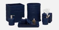 blue bathroom accessories set with soap dispenser, toothbrush holder and tissue dispenser