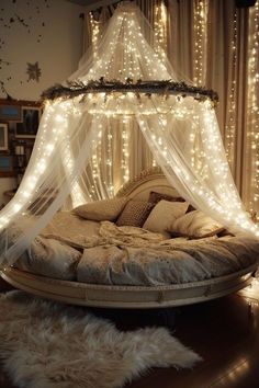 a bed that has some lights on the headboard and is covered in white netting