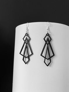 Canadian-made geometric style earrings. 3D printed and hand finished design. Lightweight materials feel easy on your ears while showcasing modern look for any occasion. Modern Geometric Ear Wire Earrings, Modern Black Geometric Earrings, Modern Geometric Pierced Earrings, Handmade Modern Geometric Earrings, Modern Handmade Geometric Earrings, Triangle Earrings, Geometric Earrings, Deathly Hallows Tattoo, Style Earrings