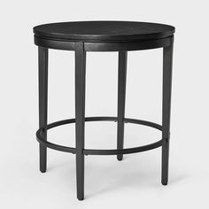 a black stool with a round wooden seat