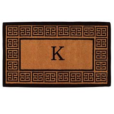 a door mat with the letter v on it and an interlaced border in black