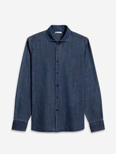 Upgrade your fall wardrobe with our arthur denim shirt. made from lightweight indigo cotton this go-to button-up offers a fresh casual vibe with its spread collar and black buttons. perfect for any outfit this shirt is a stylish and versatile addition to your closet.    - denim twill fabric  - light weight  - textured  - spread collar  - clean minimal look  - 100% cotton Dark Wash Button-up Shirt For Summer, Dark Wash Shirt With Button Closure For Summer, Dark Wash Button Closure Shirt For Summer, Classic Medium Wash Shirt With Button Cuffs, Washed Blue Button-up Shirt For Casual Gatherings, Classic Dark Wash Denim Top With Button Closure, Collared Indigo Denim Top With Button Closure, Collared Denim Blue Shirt, Classic Indigo Shirt For Summer