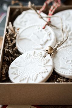 some ornaments are in a box on a table