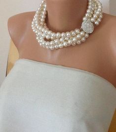 Bridal ,Multi Strands Wedding Pearl Necklace ,Rhinestone Brooch, I designed this very romantic necklace with ivory pearls and rhinestone clasp Your best gift for your bridesmaids! It is boho chic design and also vintage inspired work It is beautiful,stylish,elegant wedding accessory! You can Crystal Pearl Necklace With Rhinestones For Wedding, Pearl White Rhinestone Necklace For Wedding, Elegant Pearl Necklace With Rhinestones For Wedding, Wedding Pearl Necklace With Rhinestones, White Pearl Bridal Necklace With Rhinestones, Crystal Pearl Necklace For Wedding, White Pearl Bridal Necklace For Bridal Shower, Round Pearl Embellished Necklace For Wedding, Wedding Pearl Necklace