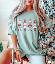 Our Comfort Colors Christmas Elfs tshirt is cozy and perfect for the holiday season. This diverse shelf elves shirt would be perfect for holiday shopping, a Christmas party, family holiday gatherings, or to just wear throughout the season to make yours and everyone else's spirits BRIGHT! Our Christmas tee is just as fashionable as it is comfortable. Try our Christmas shirt in plus size for a roomy fit! ✩ Christmas Elf Shirt Comfort Colors Merry Christmas Crewneck Tee Oversized Cute Xmas Tshirt W Elves Design, Red Crew Neck T-shirt For Christmas, Christmas Elfs, Christmas Green Cotton T-shirt, Relaxed Fit Christmas T-shirt For Holiday, Elf T Shirt, Elf Shirt, Shirt Oversize, Christmas Elves