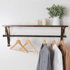 This innovative piece combines a clothing rod and floating shelf, offering ample storage and display space. Enhance your walk-in closet, bedroom, bathroom, or entryway with additional storage options. The wall brackets are designed for easy mounting on any flat surface. Crafted from solid Paulownia wood boards and powder-coated metal brackets, this floating shelf is a fantastic selection for showcasing collectibles, small plants, stuffed animals, and more, adding a touch of elegance and function Bracket Shelf, Paulownia Wood, Shelf Wood, Bar Black, Wood Boards, Hanging Bar, Bathtub Accessories, Display Shelf, Wall Mounted Shelves