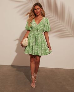 V-neckline Puff sleeve Babydoll fit Tropical print Mini length Lined Self: 53% Rayon 30% Polyester 12% Linen 5% Cotton, Lining: 100% Cotton Runs Large Leaf Green, Swim Shop, Printed Mini Dress, Tropical Print, Modern Classic, Puff Sleeve, Midi Dress, Maxi Dress, Mini Dress